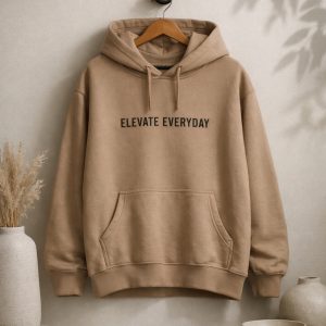 Beige hoodie with black print written, "Elevate everyday".